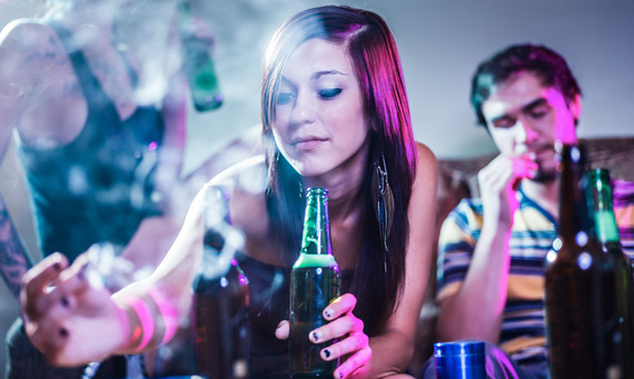 Woman with cigarette and alcohol