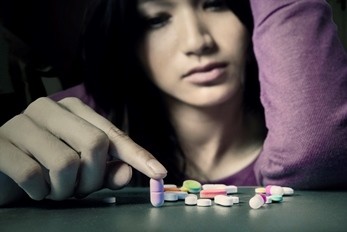 teen girl with pills