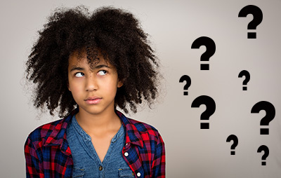 teen girl surrounded by question marks