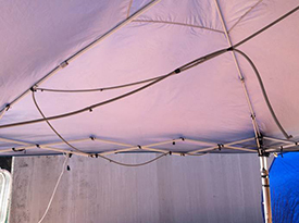 Ballard Marine Construction uses canopies equipped with hoses to provide its workers with shade and cooling mist that protect them from the heat.