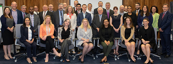 Deputy Assistant Secretary Loren Sweatt, USDOL-OSHA, (seated, center), and members of the OSHA Alliance Program Forum pose for a picture on May 3 in Washington, DC.