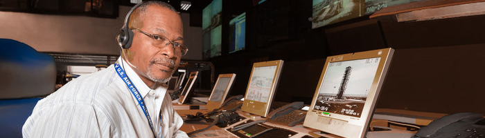 VETS - Air Force Veteran at work with computer screens