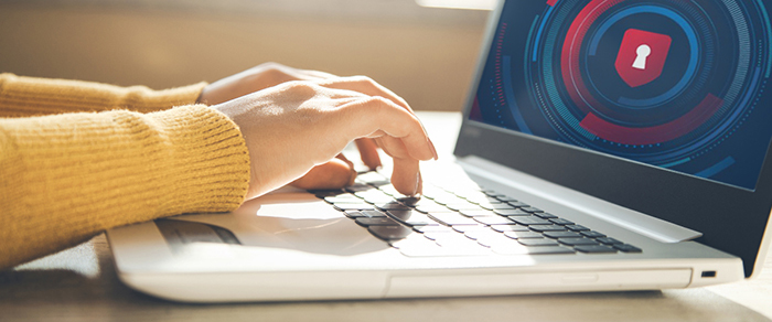 Person typing at a computer