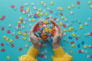 A close-up of scattered, colorful puzzle pieces, symbolizing neurodiversity, being gathered up by a pair of hands