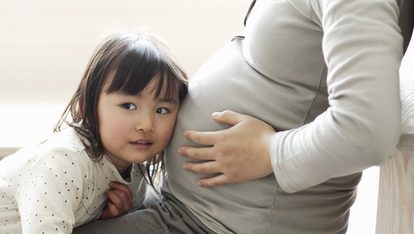 Kid with pregnant mom