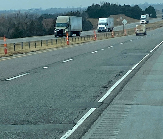 Section of I-40 in Oklahoma showing cracks in pavement.
