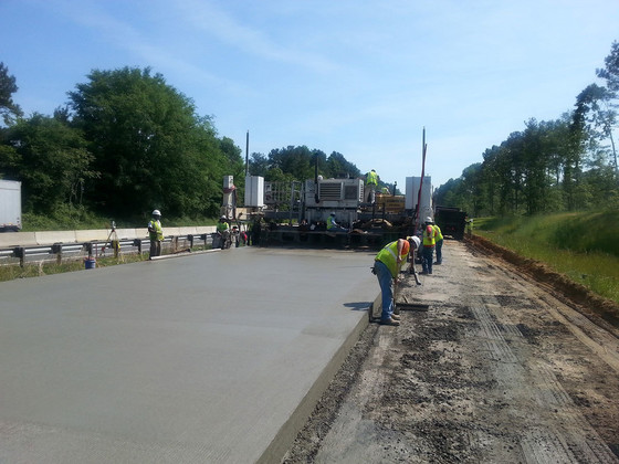 Paver machine installs a concrete over concrete unbonded overlay