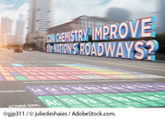 Periodic table overlay a roadway with text: 