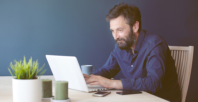 Man working from home on laptop computer