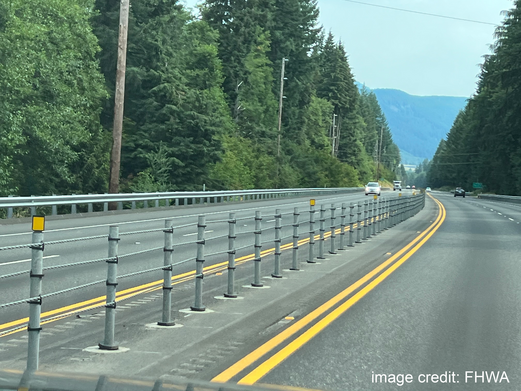 Road with left-side guardrail