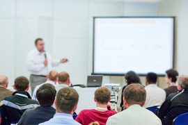 Instructor Leading a Course full of learners