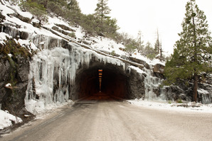 Tunnel entrance with icicles above the entrance and on the sides