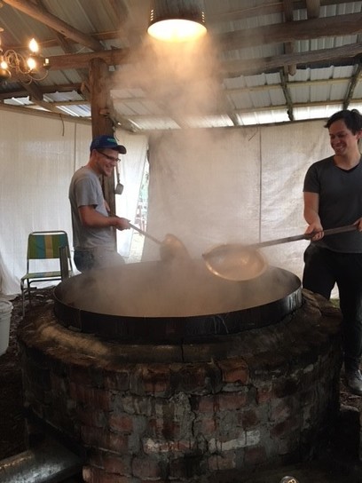 Pete Tomczik (left) and Anders Kosnett boiling sugarcane syrup. Hortense, GA. 2016