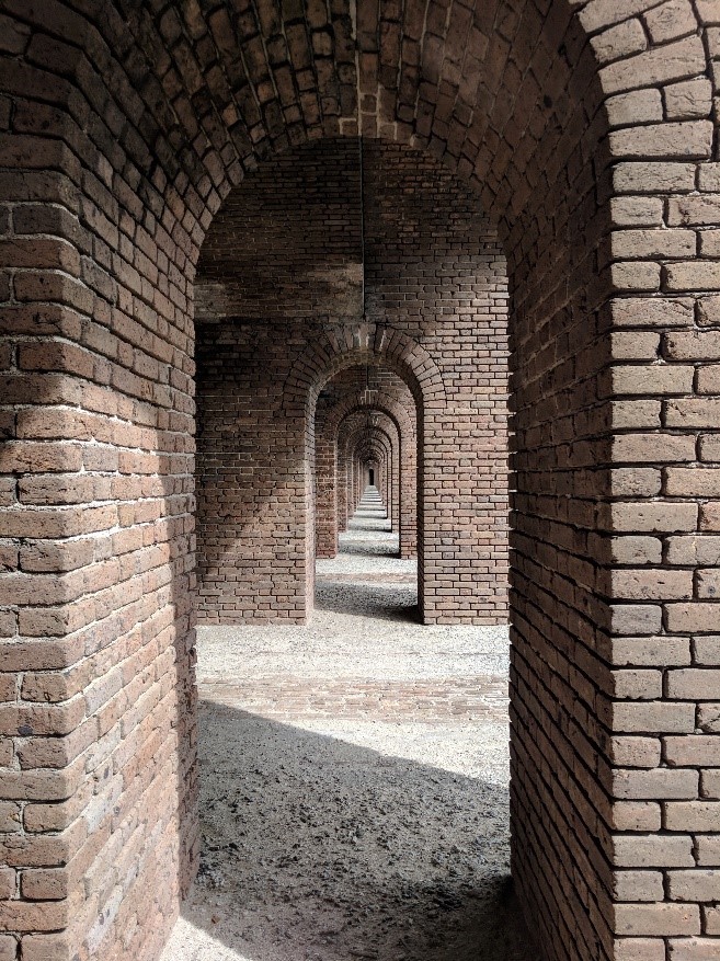 Image of tall arches within a larger fort