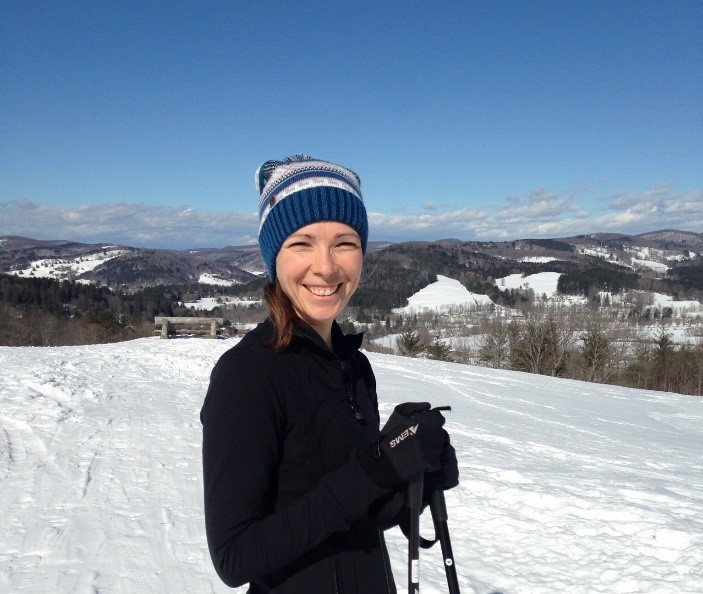 Woman with hat on skiing