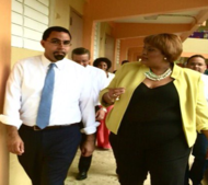 John King alongside female school official