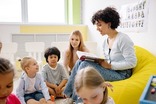 Teacher reading to a class of young children