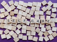 SELF CARE spelled out with wooden blocks