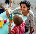 Teacher playing with young child