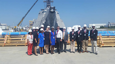 EDA Deputy Assistant Secretary Matt Erskine and Policy Advisor Julie Wenah pose for a photo with manufacturing students at Austal USA in Mobile, AL