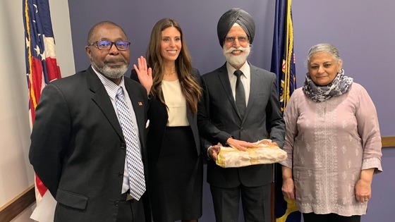 Amrith Aakre (second from left) poses during her swearing-in ceremony as the director of the EEOC’s Chicago District on Jan. 29.