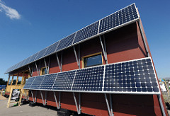 photo of a house with a PV array of 19 panels on the exterior side