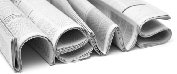 Several rolled-up newspapers