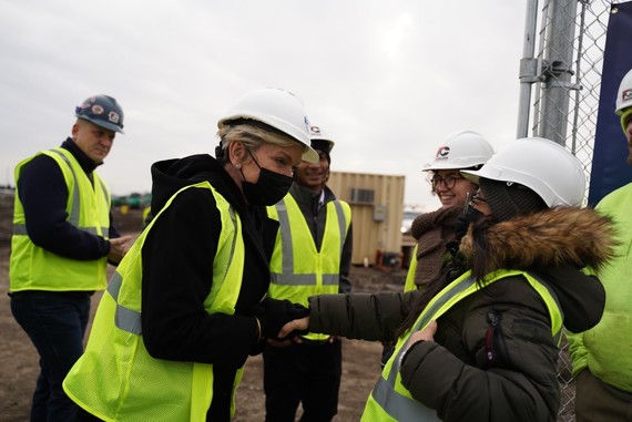 Photo of Energy Secretary Jennifer M. Granholm shaking hands with a worker at the Gar Creek community solar site
