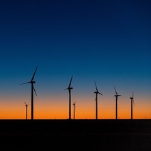 Wind turbines against the sunset.