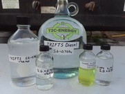 Different sized glass containers holding various liquids labeled as part of the project. 