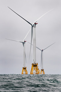 Offshore wind turbines at sea.