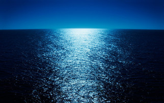 A calm sea at night.