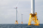 Offshore wind turbines at sea.