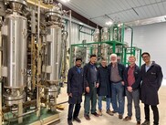 Scientists from ORNL, Pyran, and RPD Technologies pose in front of the pilot-scale reactor testbed