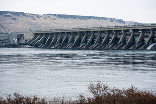A dam with reservoir behind it