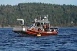 A boat in the middle of a large body of water as part of a tour