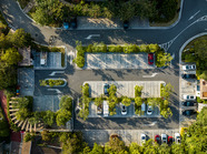 Birds eye view of charging electric vehicles.