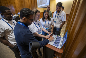 People looking at a computer