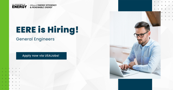 Image of a man sitting at a computer