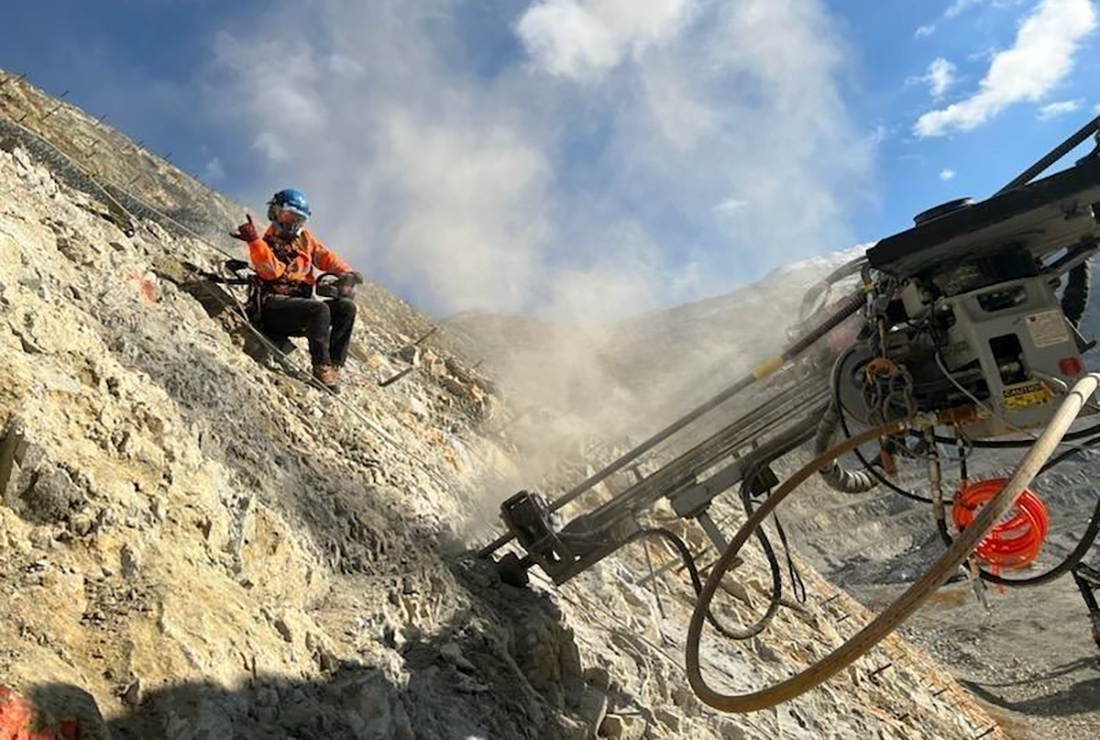 Madeline Nelson installs safety mechanisms, like protective mesh that can catch falling rocks.