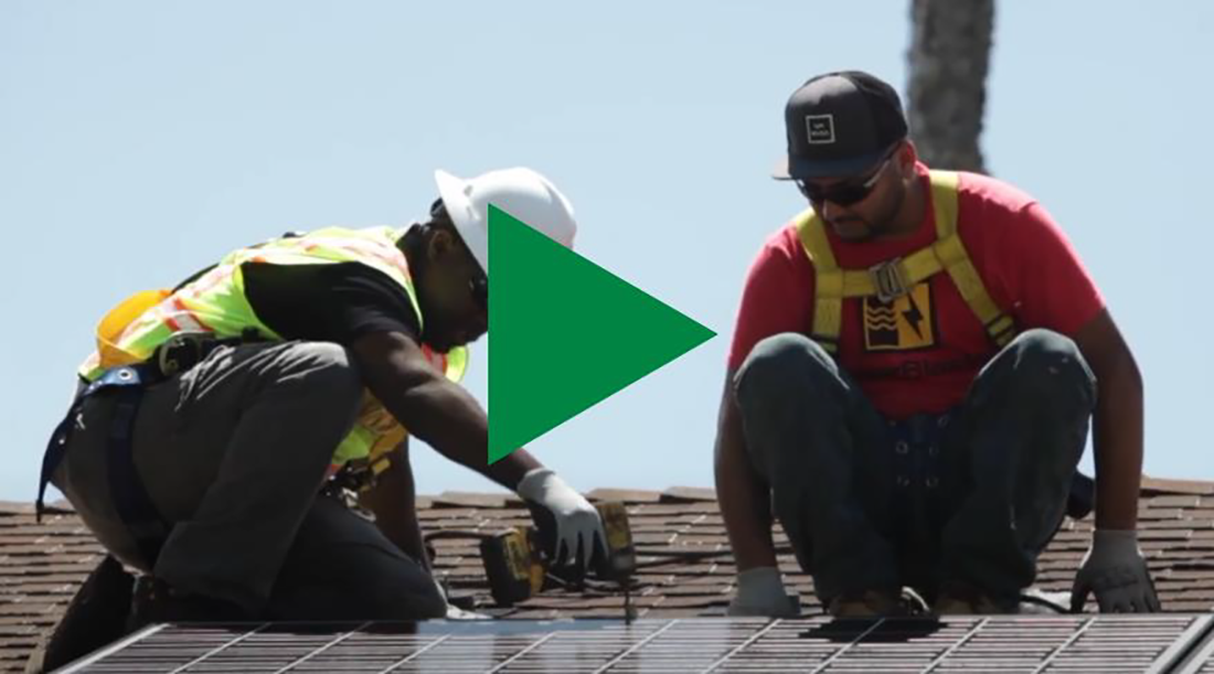 Video thumbnail: Two men install solar panels on roof