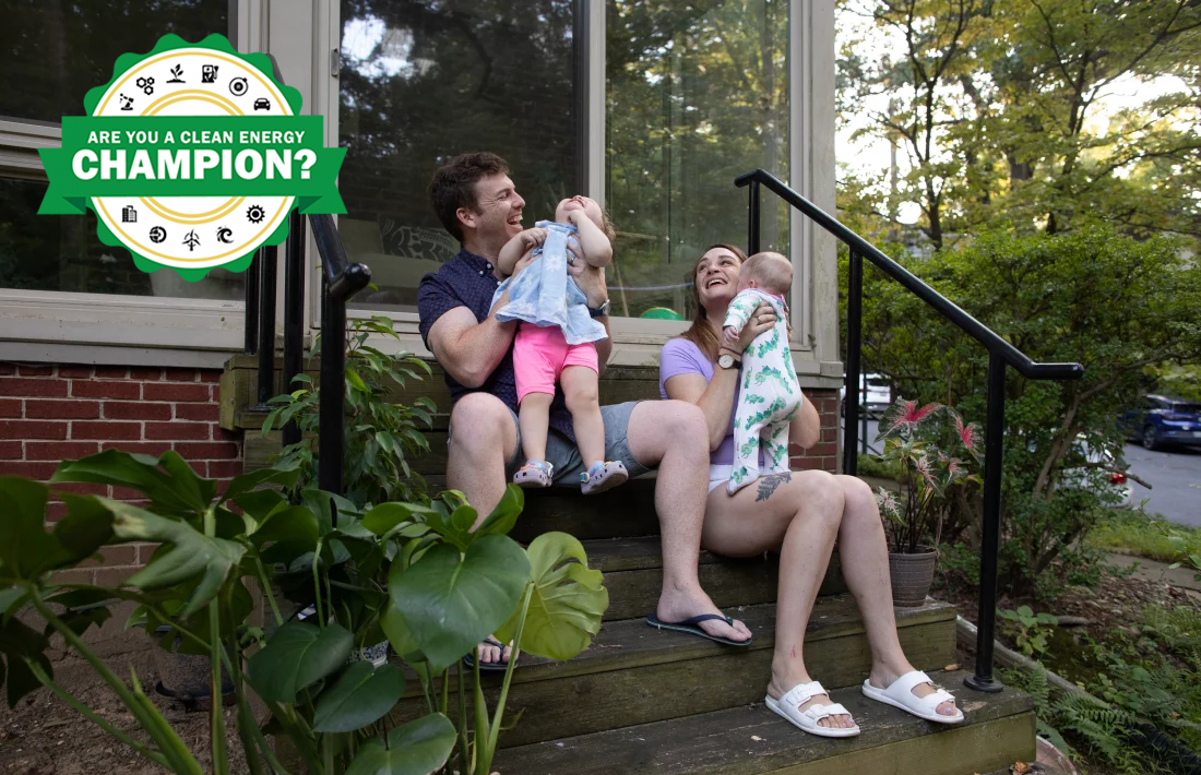 Clean Energy Champion Micaeli du Plessis and her family on front steps of home