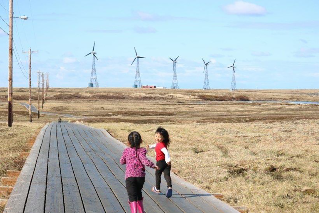 Children run along the boardwalk in the remote village of Kongiganak on Alaska’s Yukon Kuskokwim Delta.