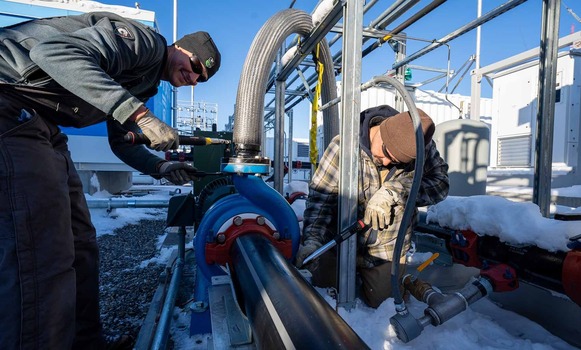 Men working on pipes