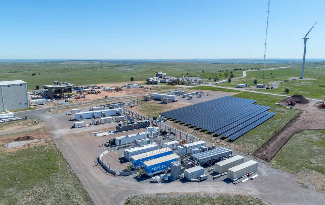 Aerial view of National Renewable Energy Laboratory’s Flatirons Campus, showing a photovoltaic array and the CGI.