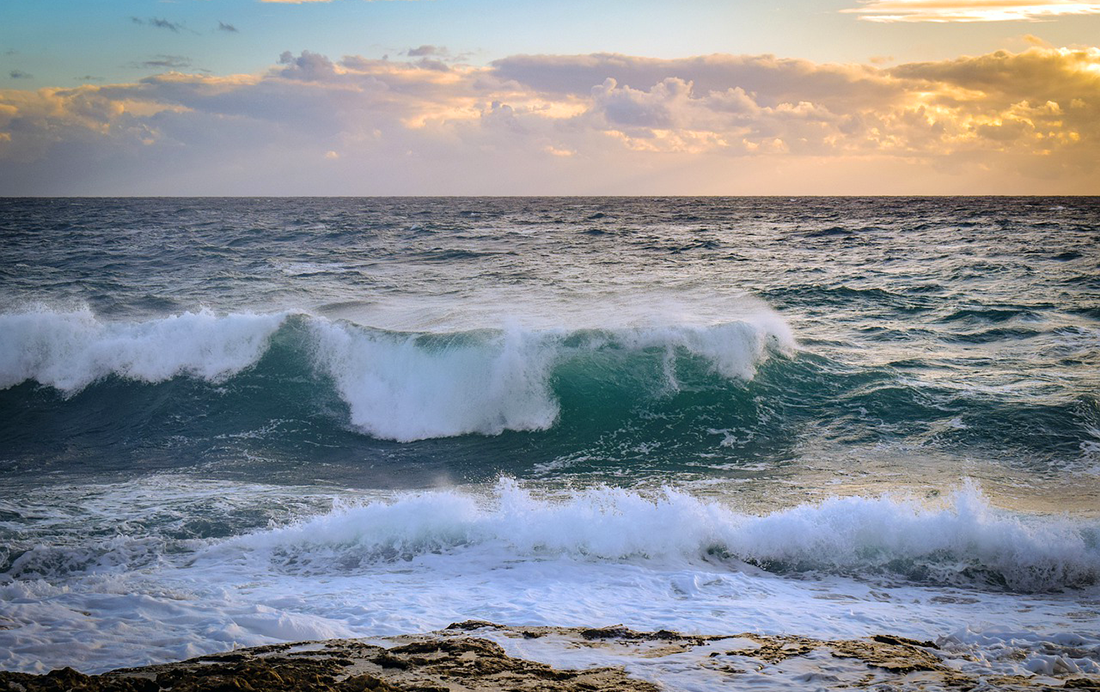 Waves crash along the seashore