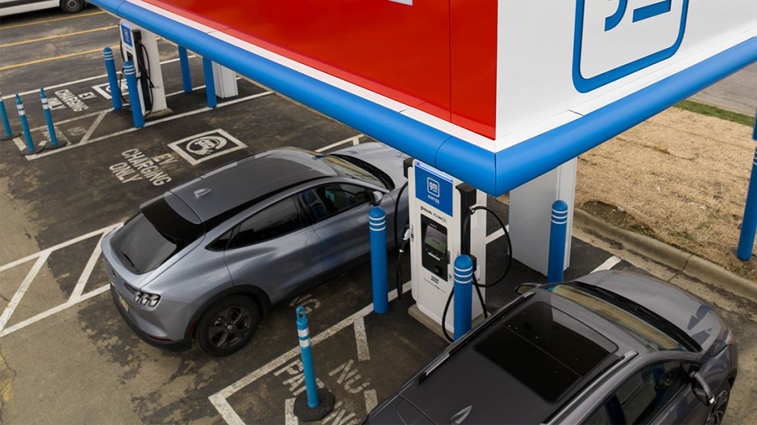 A car charges at a public EV charger.
