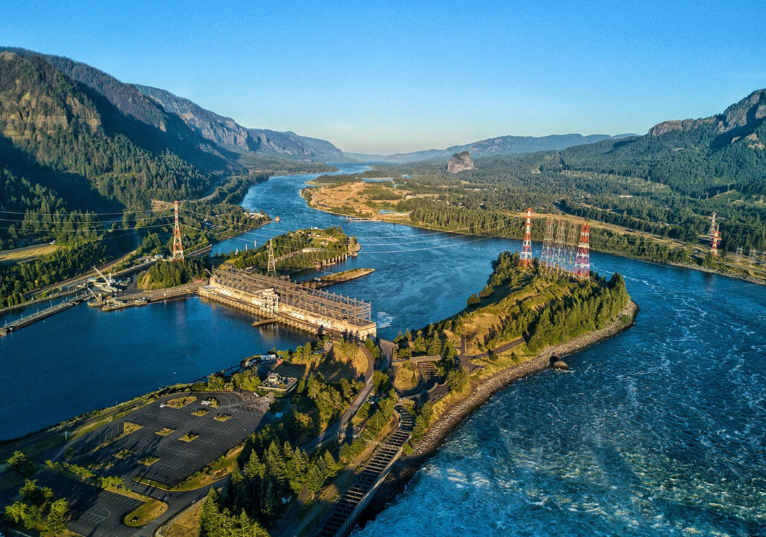 A hydropower dam sits in a winding river.