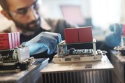 Image of man conducting research on power electronics for marine energy development.