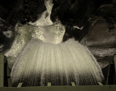 Water flowing over a spillway in a hydropower facility